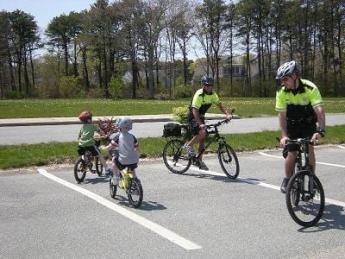 Brewster bike patrol with children on bicyles